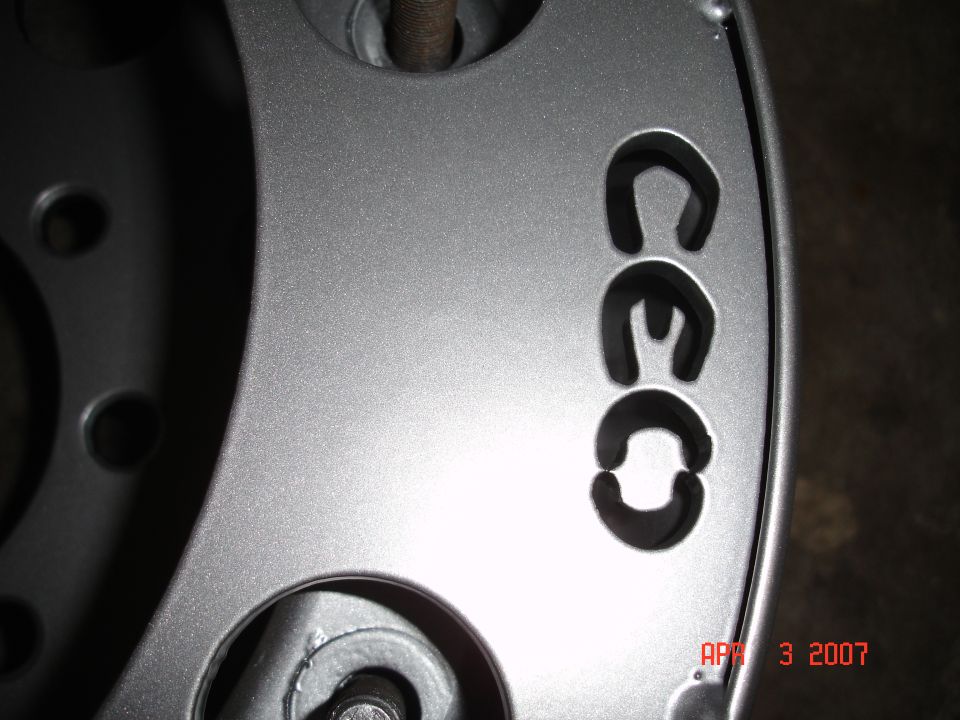 Silver wheel with black text CEC