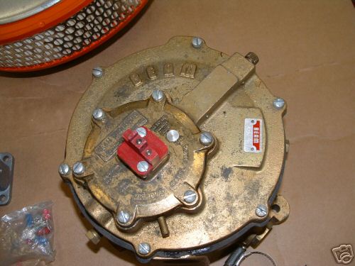 Brass propane converter with red cap and air filter component