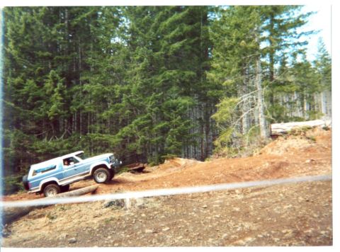 1989 Ford Bronco - Climbing the log that crosses the road. Why? to get to the other side of course