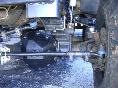 1995 Ford Bronco - This image shows the underside of a vehicle, focusing on its suspension and steering system components.