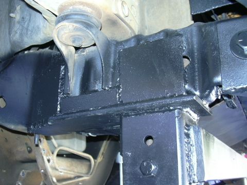 1995 Ford Bronco - Custom welded brackets are visible on the vehicle's frame, suggesting a modification.
