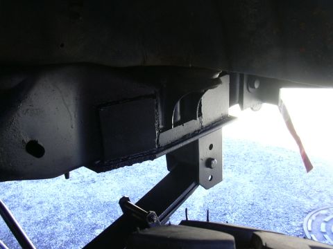 1995 Ford Bronco - This image shows the undercarriage of a vehicle, focusing on a solid axle swap modification. The year is not discernible from the image.
