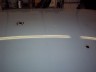 1998 Ford Crown Victoria - A white 1998 Ford Crown Victoria is parked indoors on a light gray floor.