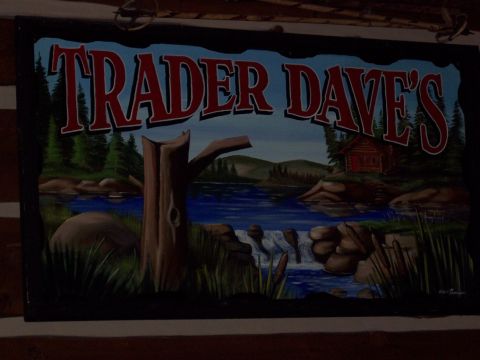 1972 Ford Ranchero - A painted sign for "Trader Dave's" shows a scenic landscape with a cabin, river, and waterfall.