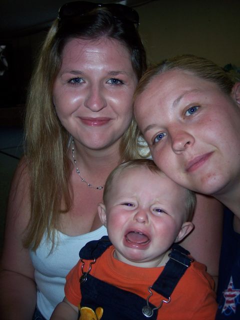 1972 Ford Ranchero - A close-up photo shows two women with a crying baby between them.