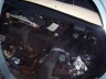1998 Ford Crown Victoria - The interior of a car is shown, filled with debris and various items.