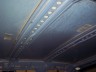 1998 Ford Crown Victoria - The interior ceiling of a space, showing rows of lights and metal framework.