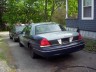 1998 Ford Crown Victoria - Rear view of a 1998 Ford Crown Victoria sedan parked outdoors.