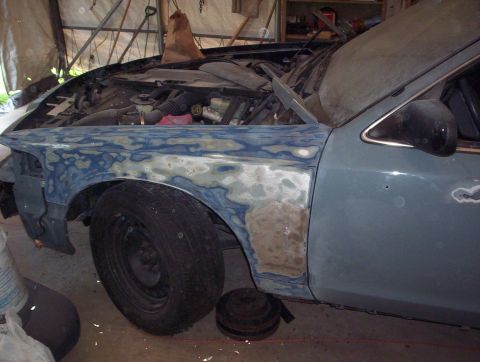 1998 Ford Crown Victoria - 1998 Ford Crown Victoria undergoing bodywork on the front fender.