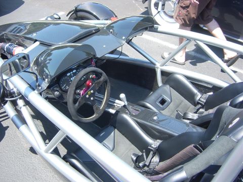 1993 Ford Probe - The exposed roll cage and carbon fiber accents are visible in this interior shot of a minimalist sports car.