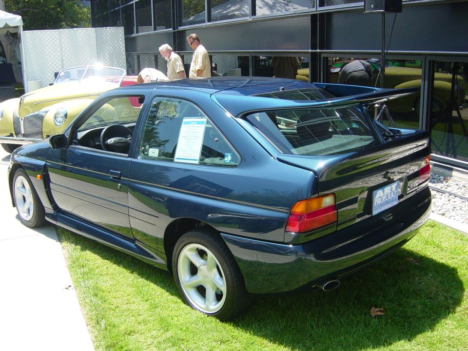 Dark blue 1993 Ford Probe with a large rear spoiler, seen from the 3/4 front