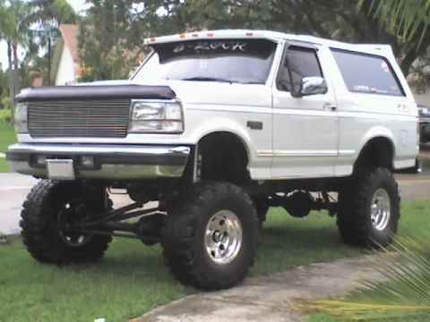 1995 Ford Bronco - This lifted 1995 Ford Bronco features a custom grille and large off-road tires.