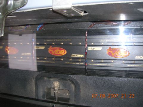 1996 Ford Bronco - Three Vibe 500 watt car amplifiers are visible in the interior of a vehicle.