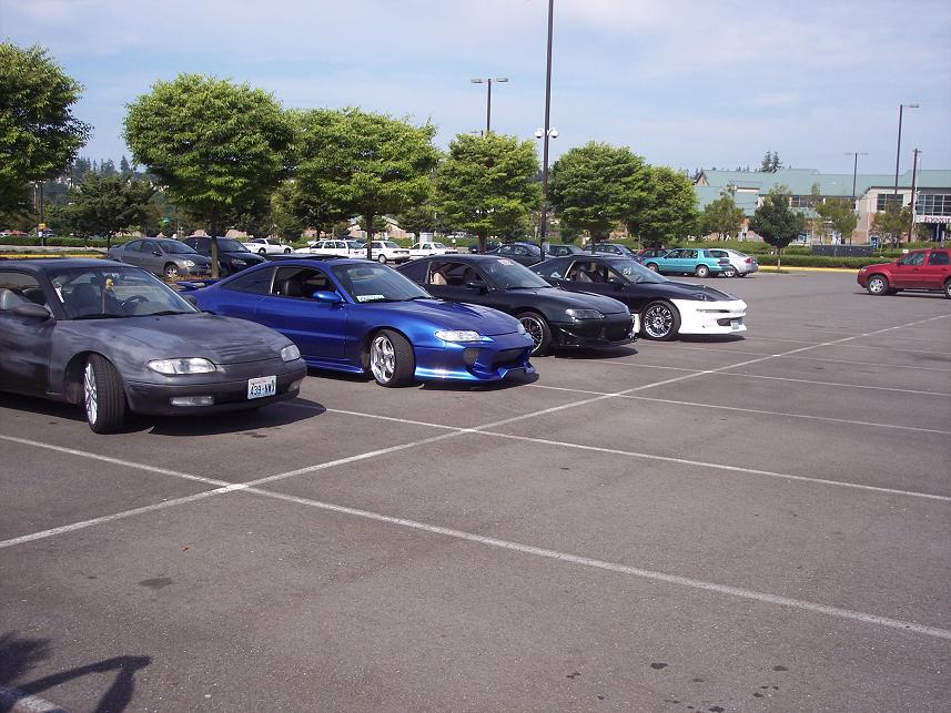1995 Ford Probe in a parking lot with other sports cars