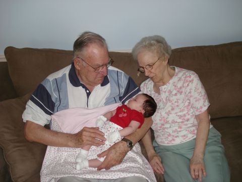 2000 Ford Crown Victoria - A family gathers to admire a newborn baby.