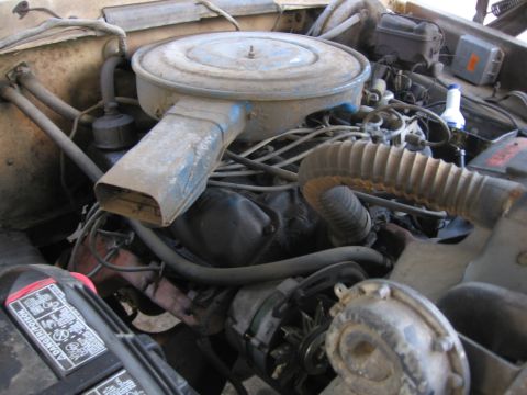 1989 Ford Bronco - Close-up view of a vehicle's engine bay, showing various components and wiring.