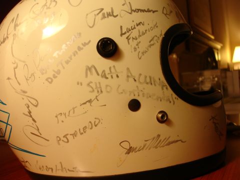 1993 Ford Taurus - This helmet is covered in signatures, with 'Matt Acuna' and 'SHO Continental' being among the legible inscriptions.