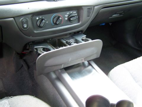 2003 Ford Crown Victoria - The interior of a car is shown, focusing on the center console area.
