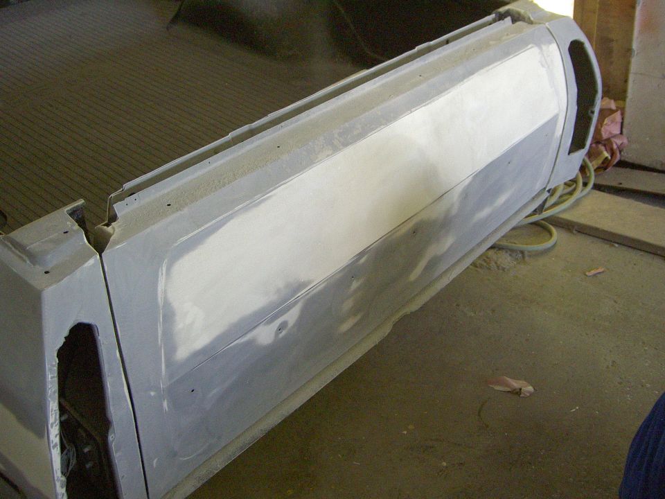car door and bed area with primer and body filler applied