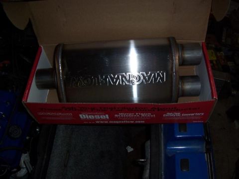 1988 Pontiac Fiero - Magnaflow exhaust muffler with "Diesel" and "High Flow Catalytic Converters" text visible on the box.