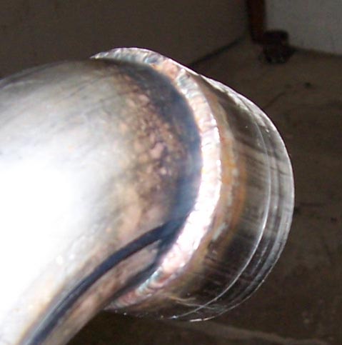 1988 Pontiac Fiero - Detail of a welded exhaust pipe, showing the craftsmanship of the joint.