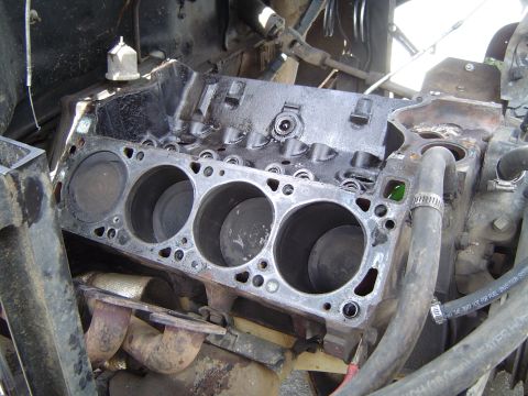 1978 Ford Bronco - Close-up view of an engine block, showing the cylinders and exhaust manifold.