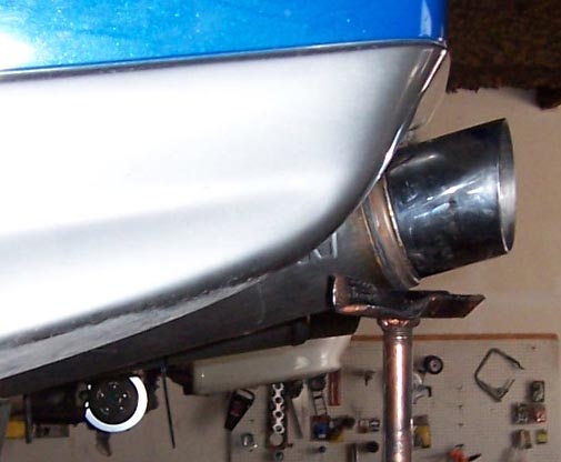 close-up of a car's exhaust pipe and rear bumper area