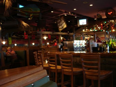 1993 Ford Taurus - Interior view of a bar with seating, a bar counter, and various decorative elements.