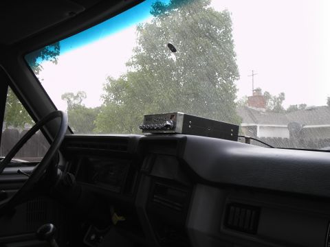 1999 Ford F-800 - The interior of a truck is shown, with a CB radio unit positioned on the dashboard.