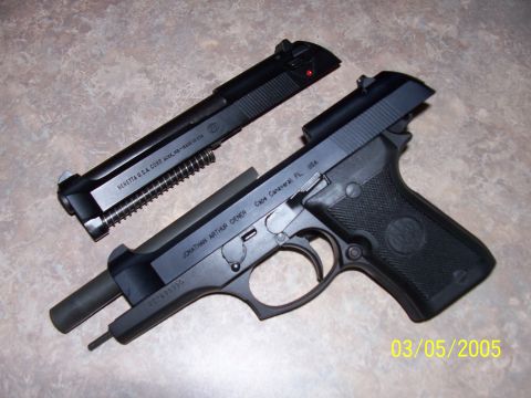 2000 Nissan Xterra - A Beretta pistol is shown disassembled, with the slide removed from the frame. Text indicates 'Beretta U.S.A. Corp.' and 'Cape Canaveral, F…