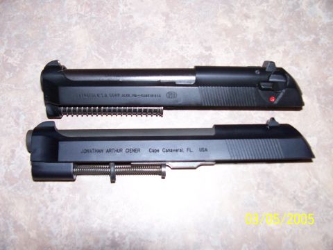 2000 Nissan Xterra - Two firearm slides are displayed side-by-side against a speckled background.