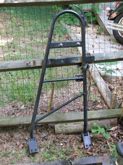1996 Ford Bronco - A motorcycle luggage rack is shown outdoors, with part of a motorcycle visible in the background.