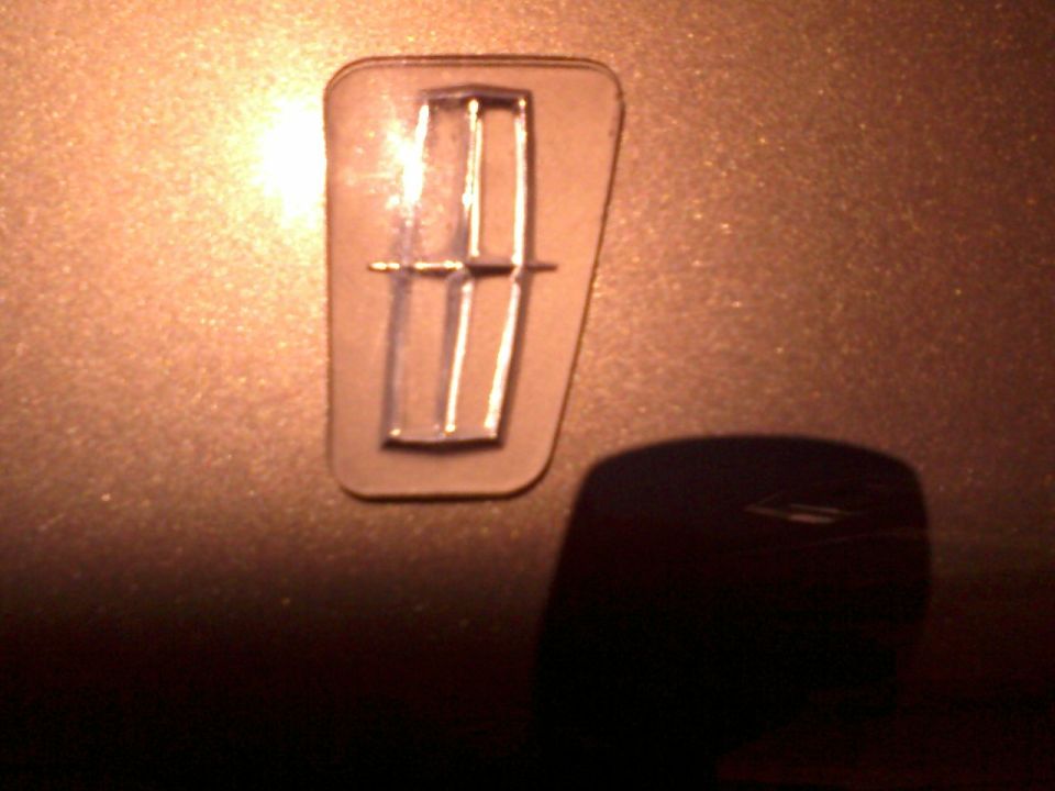 After all the background has been sanded off, I worked through the grits then polished with plastX - much like you'd do with headlamps. Make sure not to scratch the chrome start inset