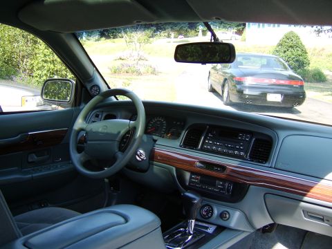 1996 Mercury Grand Marquis - Interior view of a Mercury Grand Marquis, with another car seen through the windshield.