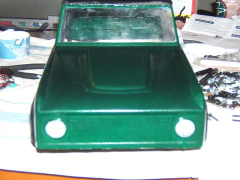 1988 Ford Bronco - Front view of a green RC car body, likely a model kit in progress.