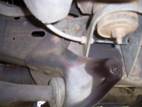 1991 Ford Bronco - Close-up view of the vehicle's suspension system and frame components.