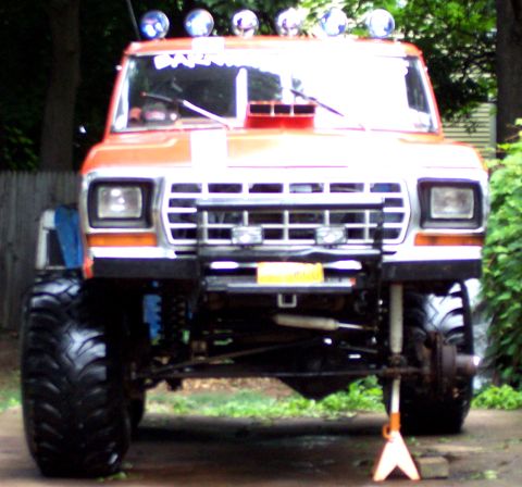 1978 Ford Bronco - This lifted pickup truck features a prominent grille and oversized tires, suggesting a model year around 1979.