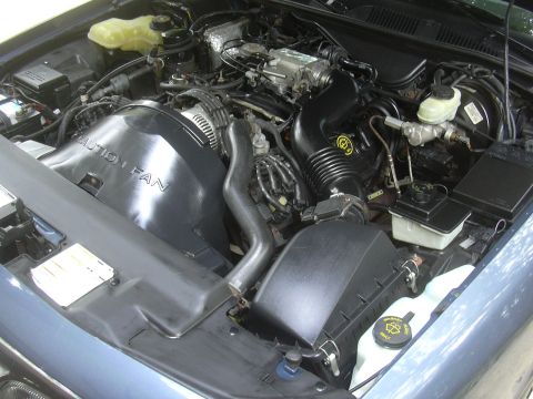 1996 Ford Crown Victoria - Engine bay of a 1996 Ford Crown Victoria, showing the V8 engine and associated components.
