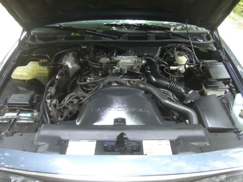 1996 Ford Crown Victoria - Engine bay view showing the V8 engine components and air intake system.