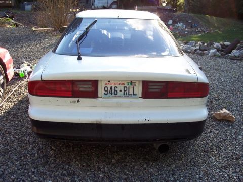 1993 Ford Probe - Rear view of a white 1993 Ford Probe with a Washington license plate.