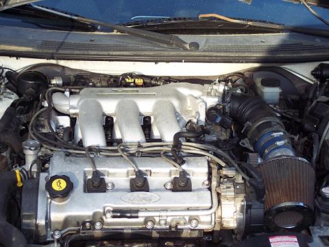 1993 Ford Probe - Engine bay of a 1993 Ford Probe, showing the V6 engine and aftermarket air intake.