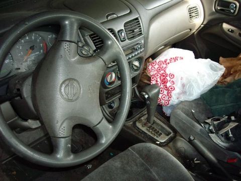 1996 Ford F-150 - Interior view of a car, showing the steering wheel, dashboard, and center console with an automatic shifter.