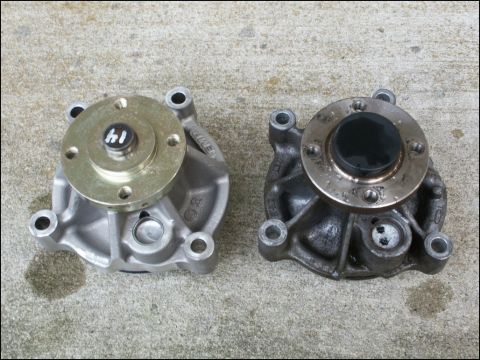2001 Mercury Grand Marquis - Comparison of a new and used water pump, with identifying marks on the new part.
