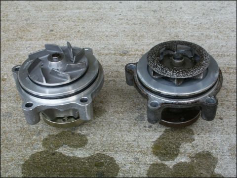 2001 Mercury Grand Marquis - A comparison of a new and used water pump, showing the wear and corrosion on the older part.