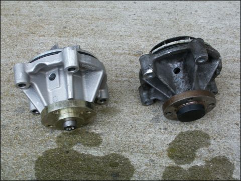 2001 Mercury Grand Marquis - Two water pumps are shown on a concrete surface, one appears new and the other used.