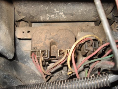 1986 Ford Bronco - Close-up view of a vehicle's electrical relay box with multiple wire connections.