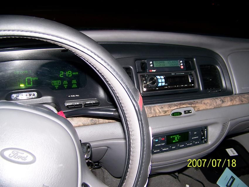 Ford instrument cluster, steering wheel and aftermarket stereo at night