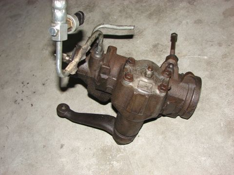 1978 Ford Bronco - A used steering gear box, likely for an older vehicle, is shown in detail against a concrete background.