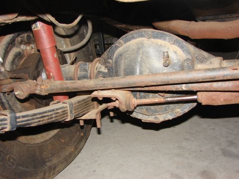 1978 Ford Bronco - Undercarriage view showing the rear axle assembly and leaf springs, typical of older off-road vehicles.