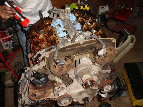 1993 Ford Taurus - Engine undergoing maintenance, timing belt system is disassembled.